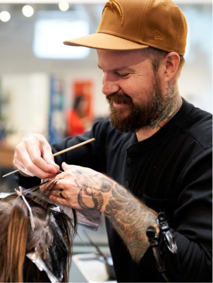 Hair stylist at Grand Salon in Denver