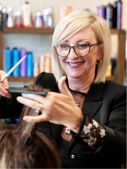 Hair stylist at Grand Salon in Denver