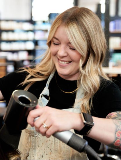 Hair stylist at Grand Salon in Denver