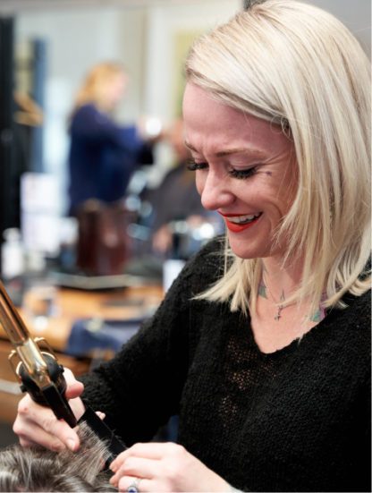 Hair stylist at Grand Salon in Denver